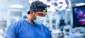 Dr. Appalanaidu performing surgical procedure in modern operating theatre